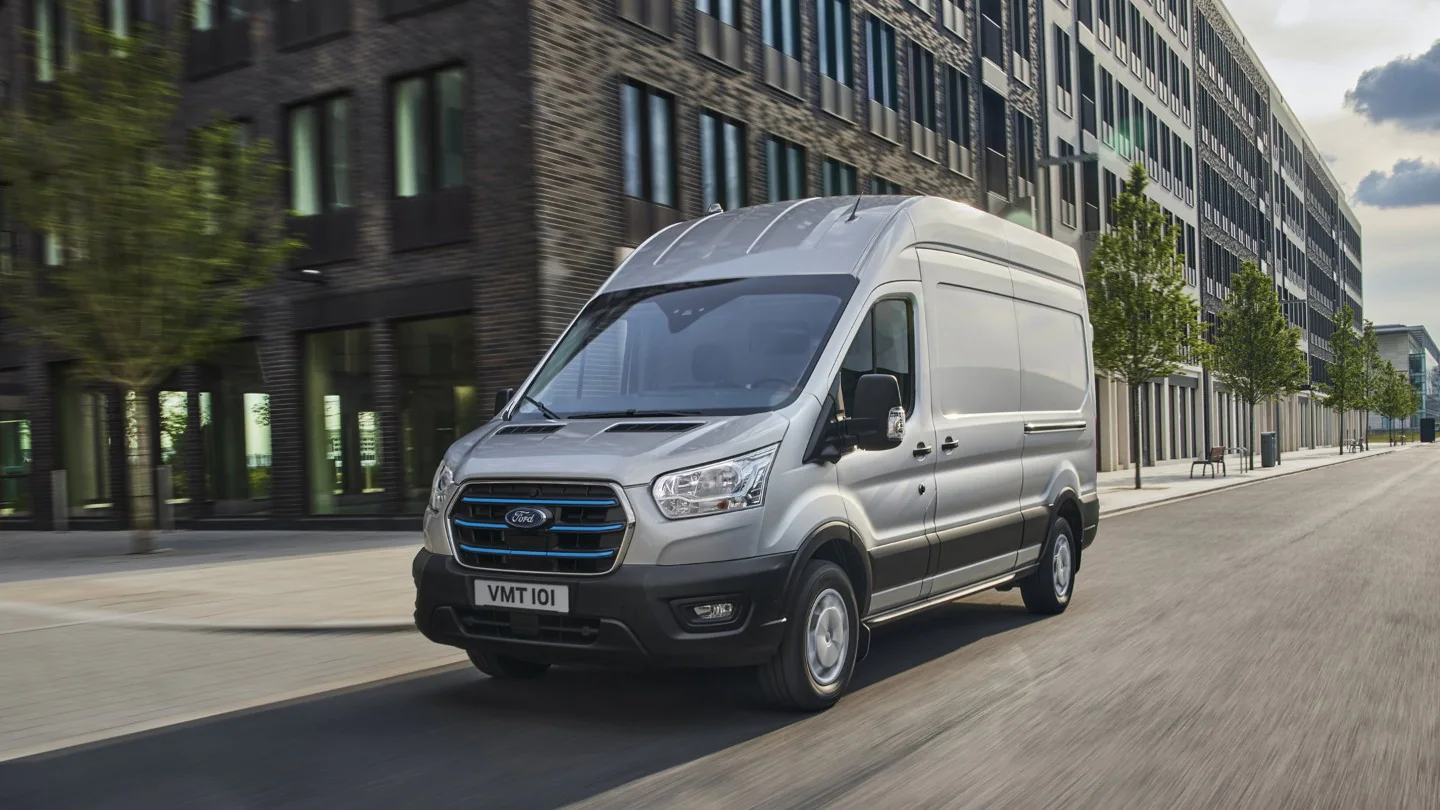 Ford E-Transit driving on a city road